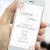 Lembrete de casamento rosé gold exibido na tela de um celular, com fundo claro, flores delicadas nos cantos, nomes do casal em caligrafia elegante e data do evento em destaque.
