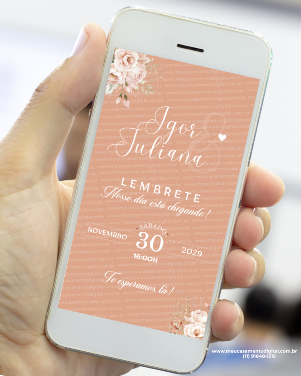 Lembrete digital de casamento rosé gold exibido em celular, com fundo em tom rosé, flores delicadas nos cantos, nomes do casal em caligrafia elegante e data do evento em destaque.