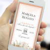 Lembrete digital para casamento rosé gold exibido em celular, com layout elegante, moldura delicada, flores suaves na base e informações do casamento com nomes e data em destaque.