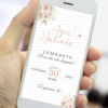 Lembrete digital rosé gold para casamento exibido na tela de um celular, com flores delicadas em tons rosé, nomes do casal em caligrafia elegante e data do evento destacada.