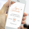 Lembrete digital terracota para casamento exibido em um smartphone, com fundo claro, flores em tons terrosos no topo e na base, nomes do casal em destaque e data central posicionada com tipografia sofisticada.